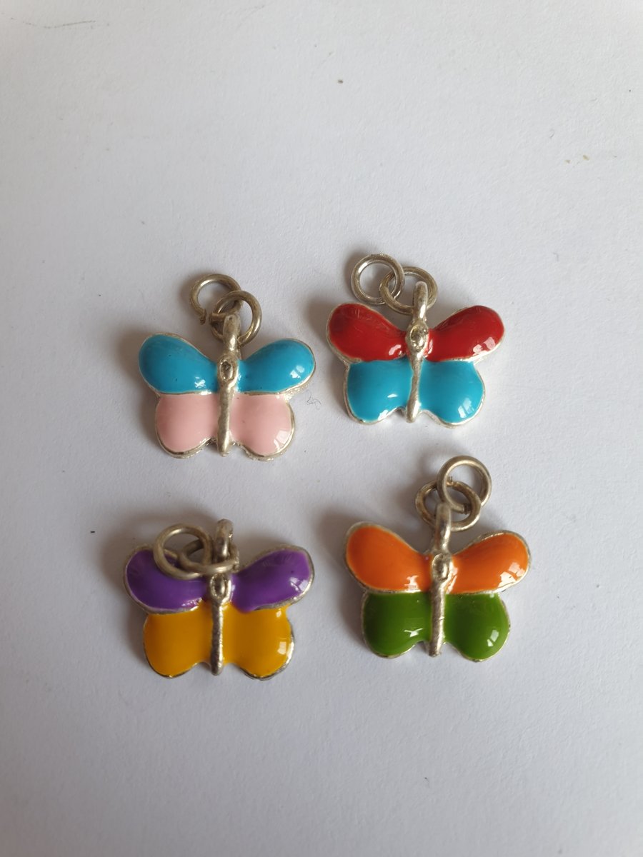 4 butterfly charms 