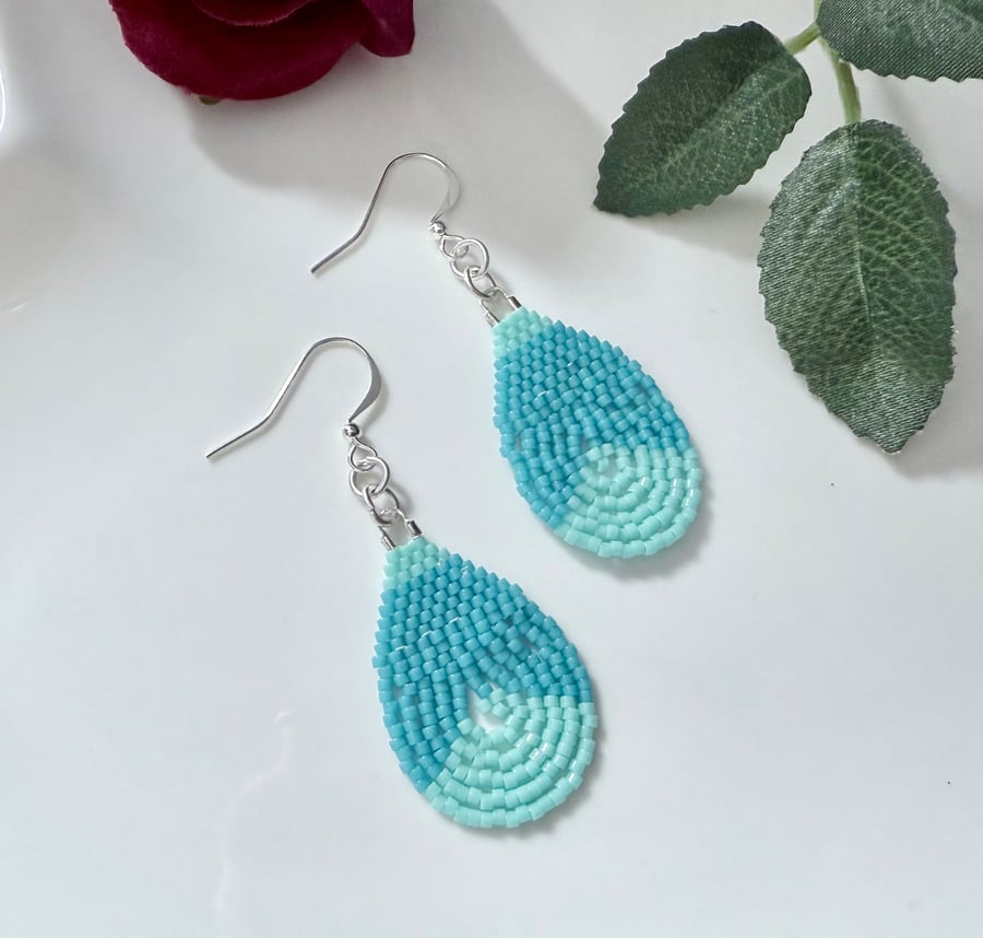 Colourful teardrop earrings in bright blue tones