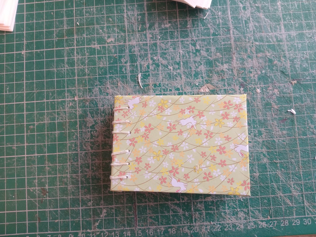 A7 mini sketchbook with budget watercolour paper and open spine 