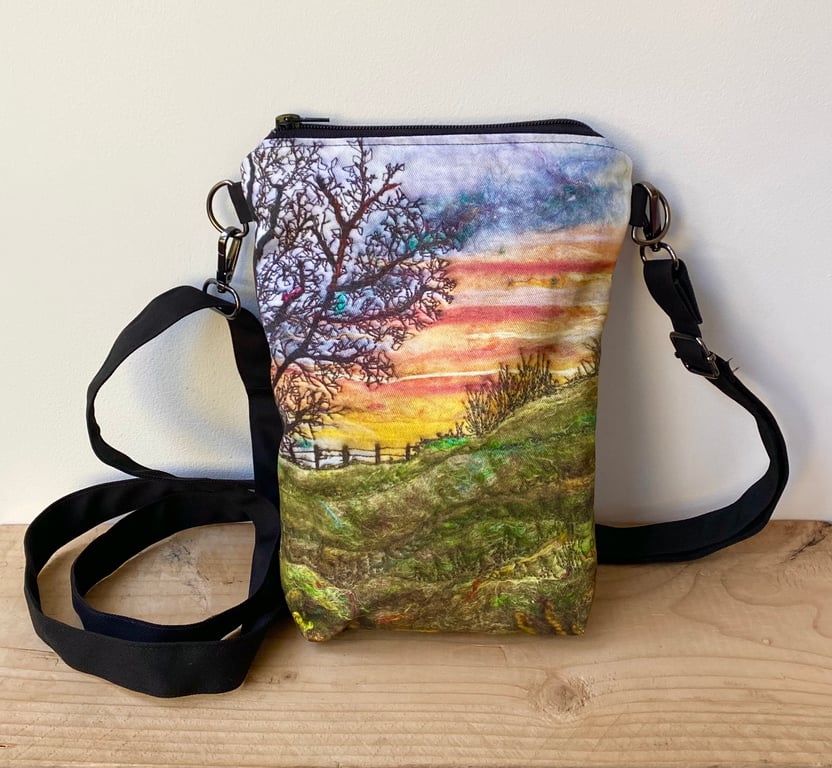 Sunrise tree and landscape cross body mobile phone bag with shoulder strap. 