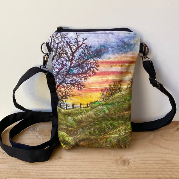 Sunrise tree and landscape cross body mobile phone bag with shoulder strap. 
