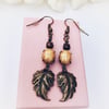 Vintage glass stone copper and beige earrings. 