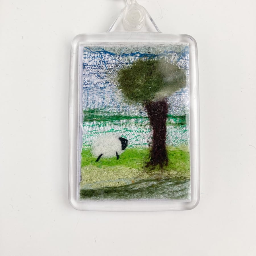 Keyring, needle felted textile art, single sheep with tree, silk and wool