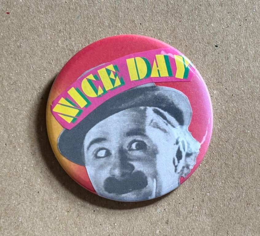 Collage pin badge - vintage book images & text - nice day