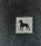 Miniature Pinscher embossed on a black hand towel in cream embroidery thread