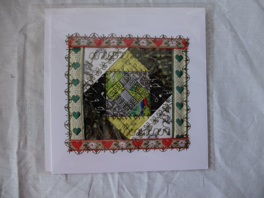 Snail trail quilt block greetings card, green and red fabrics