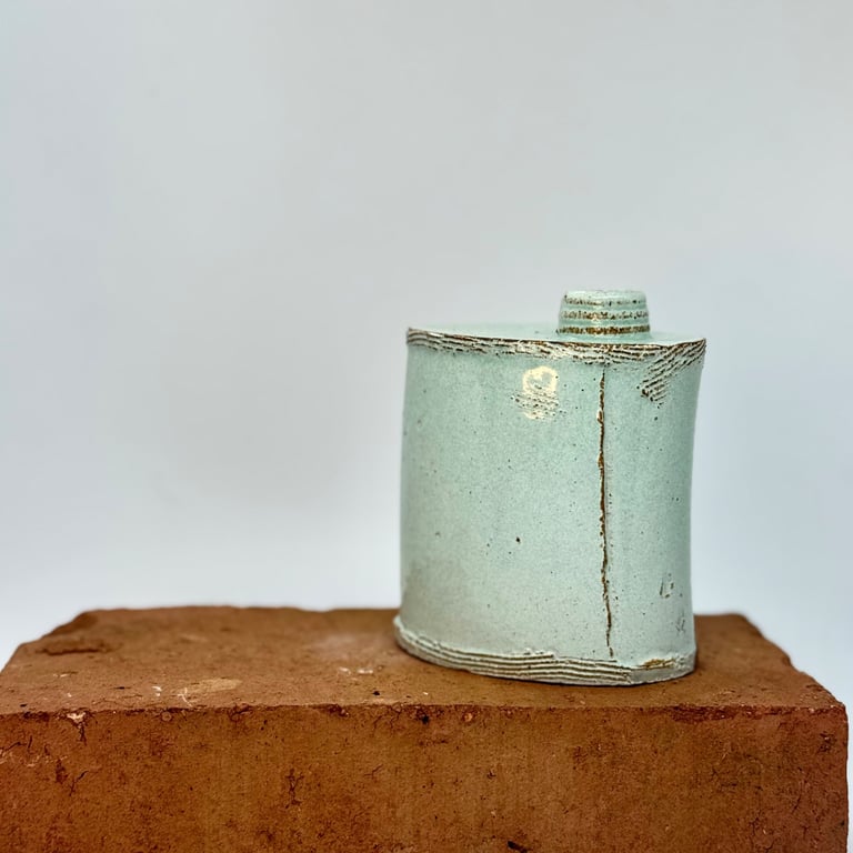 Hand built blue-green bud vase. No 4