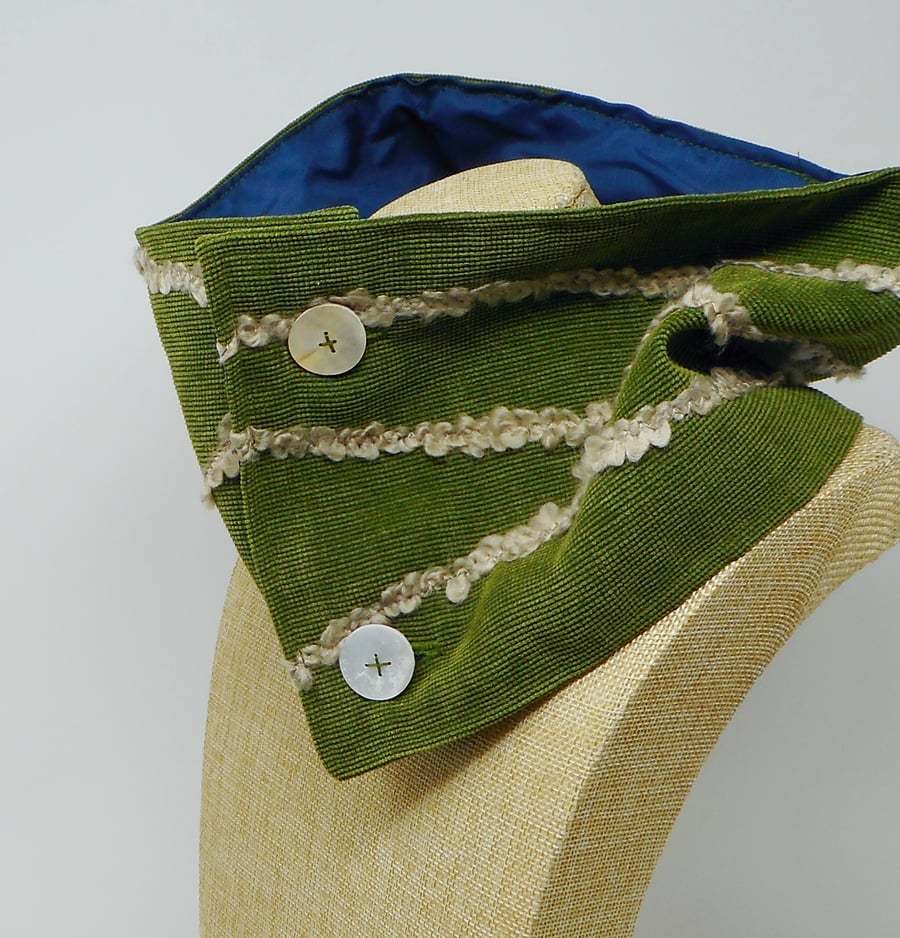 Cowl in forest green with yarn appliques