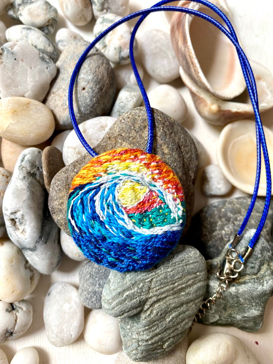 Rolling wave at sunset, hand embroidered pendant 
