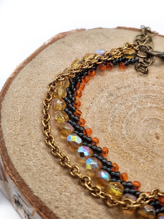 Firey orange, black and gold bead and chain bracelet