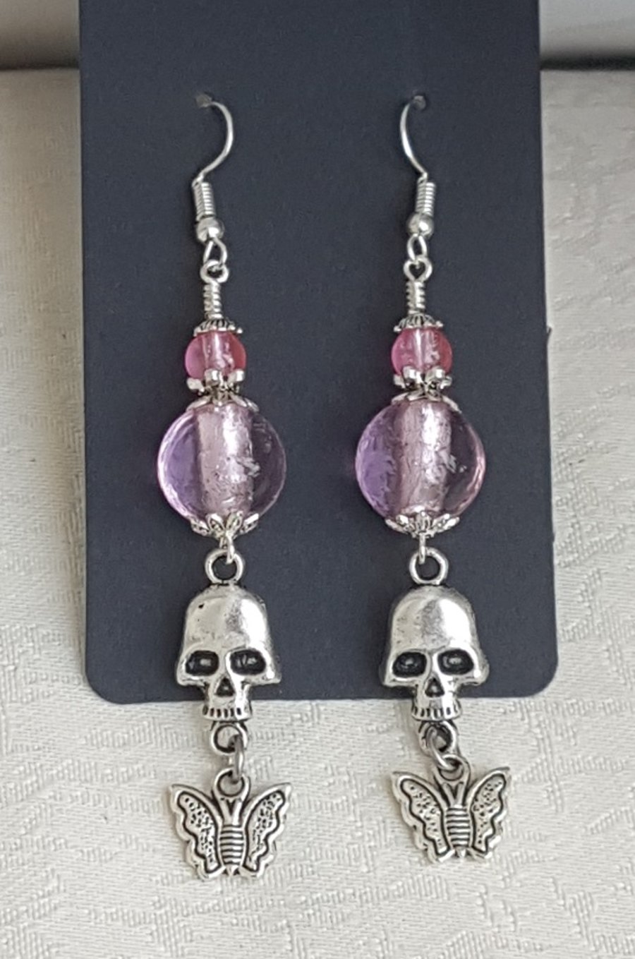 Pink Bead Earrings with Skull and Butterfly Charms.