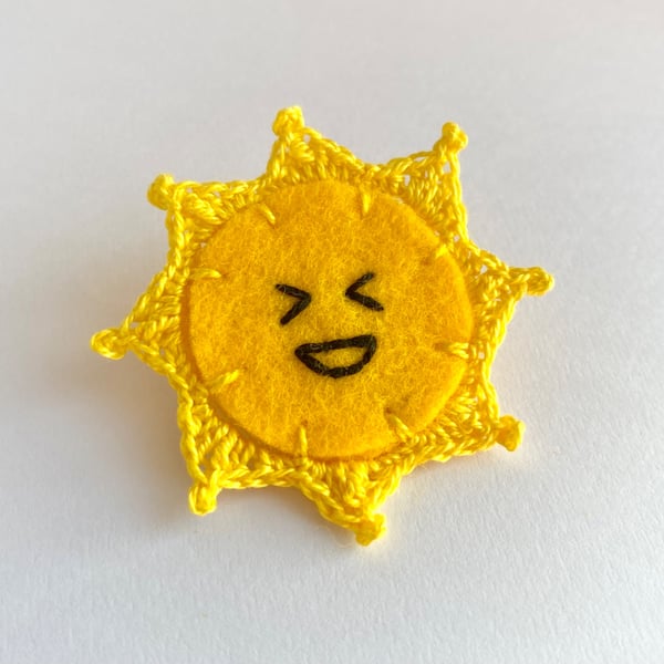 Sun brooch laughing embroidery with micro crochet sun rays