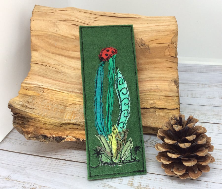 Embroidered ladybird with leaves bookmark. 