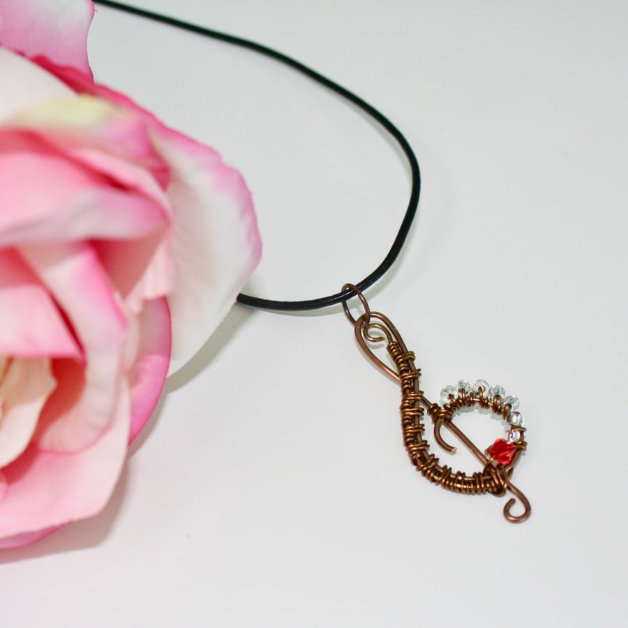Wire wrapped treble clef necklace