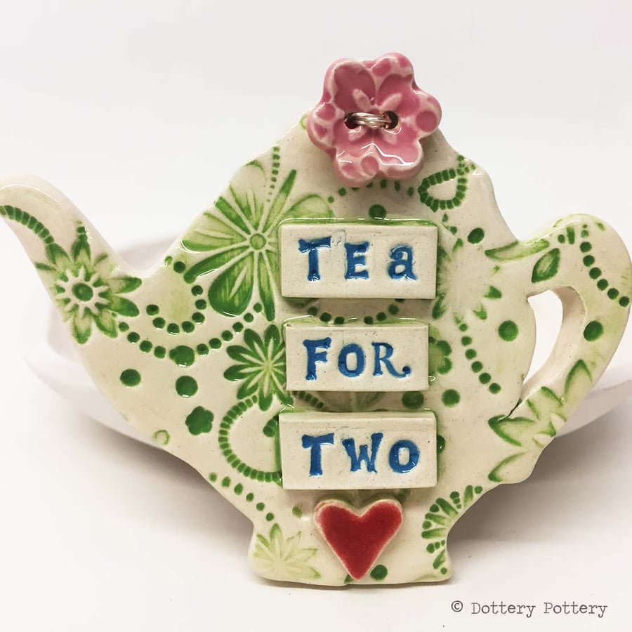 Ceramic teapot decoration with flower button pottery