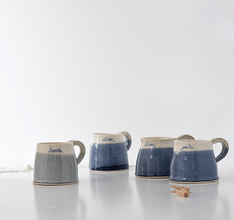 Handmade ceramic misty-green and white leaping hare mug - stoneware pottery