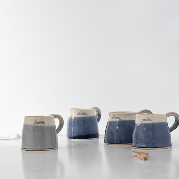 Handmade ceramic misty-green and white leaping hare mug - stoneware pottery