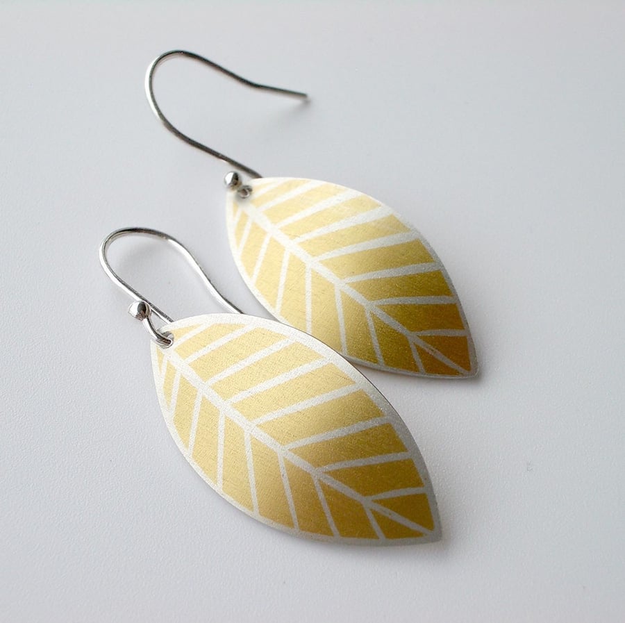 Yellow leaf oval earrings