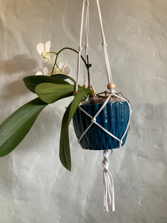 Macrame plant holder with optional pot. Made from a white tee shirt