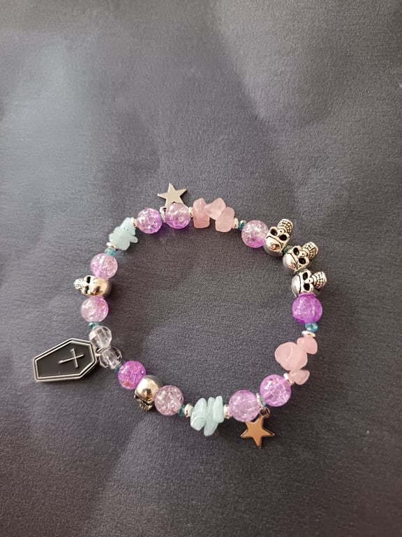 Elasticated pastel goth bracelet with skulls, stars and coffin charm 