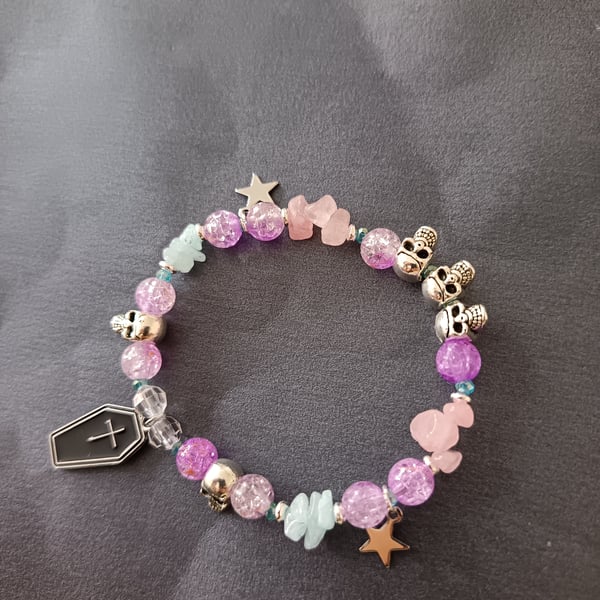 Elasticated pastel goth bracelet with skulls, stars and coffin charm 