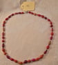 Orange paper and glass beaded necklace