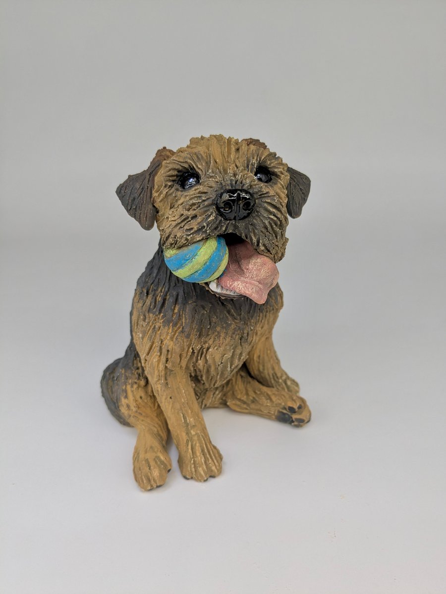 Sitting Border Terrier Sculpture (stripey ball in mouth)