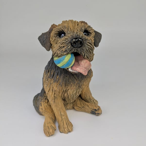 Sitting Border Terrier Sculpture (stripey ball in mouth)