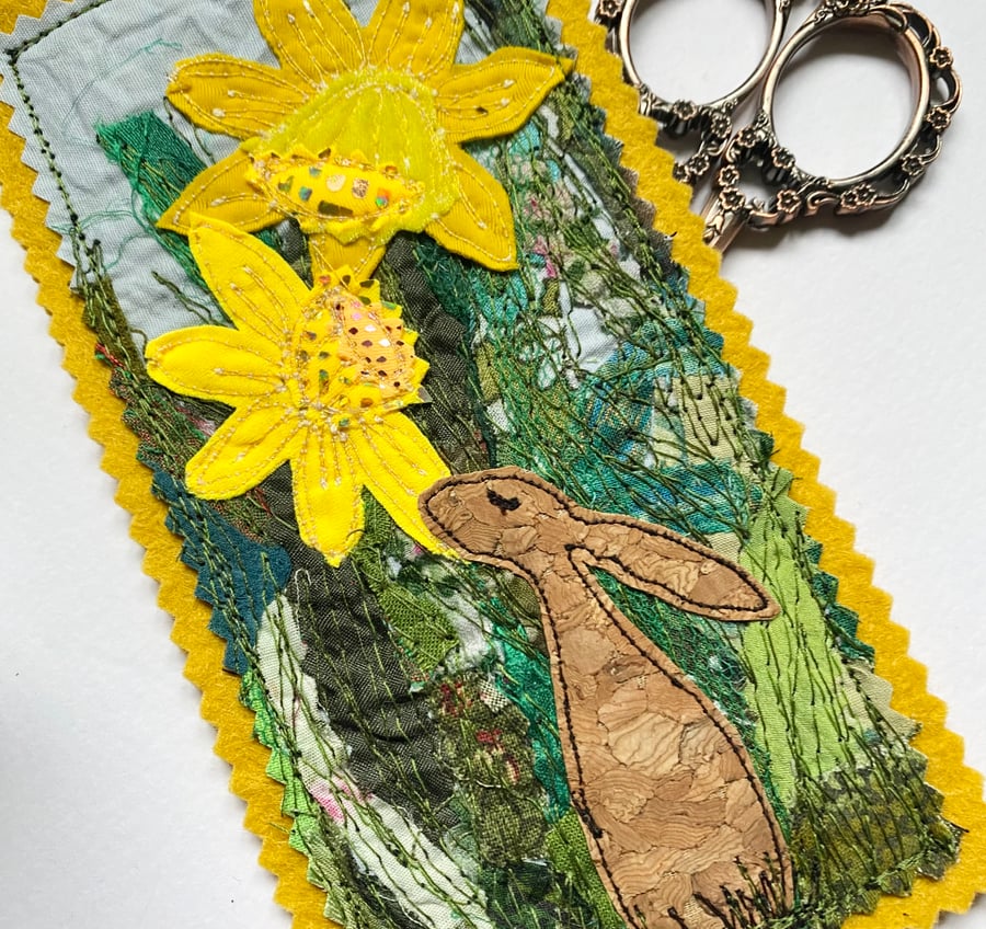 Upcycled embroidered spring rabbit and daffodil home decoration. 