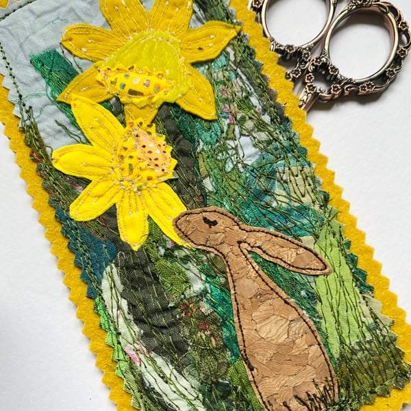 Upcycled embroidered spring rabbit and daffodil home decoration. 