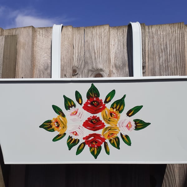 Rectangular hanging planter hand painted with canal art style roses.