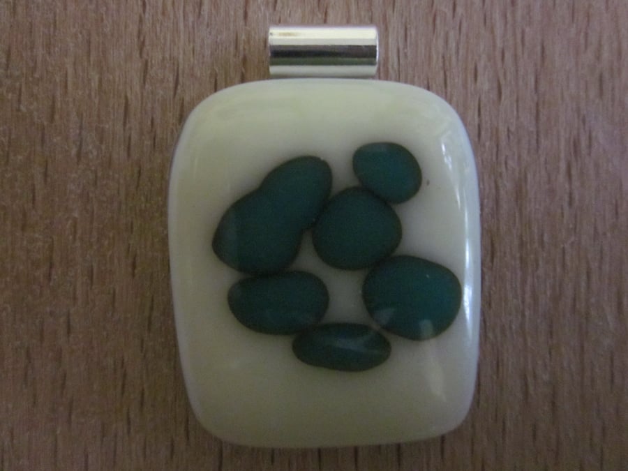 Handmade glass cabochon pendant - vanilla with teal reaction