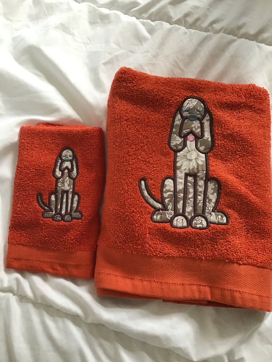 Towel and flannel set in burnt orange with dog on.