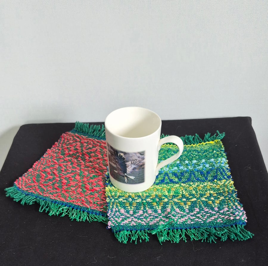 44. A Pair Of Handwoven Mug Mats