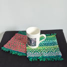 44. A Pair Of Handwoven Mug Mats
