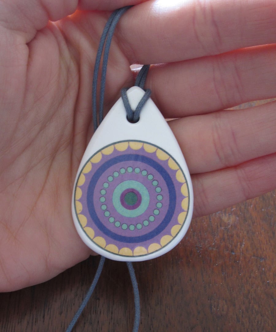 Purple Concentric Circle Pattern Ceramic Pendant on Grey Cord with Lobster Clasp