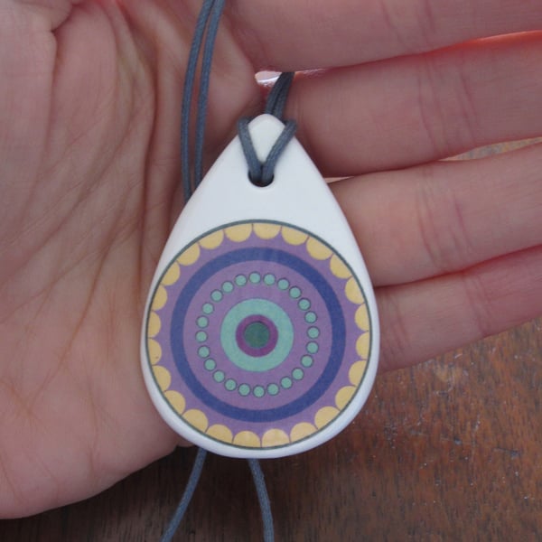 Purple Concentric Circle Pattern Ceramic Pendant on Grey Cord with Lobster Clasp