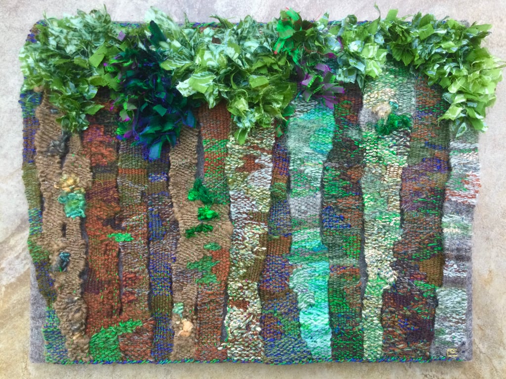 Mounted handwoven tapestry weaving,  textile art in browns, greens and blues
