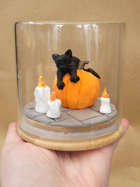 Asleep on the job - Sleeping cat ornament in a glass jar