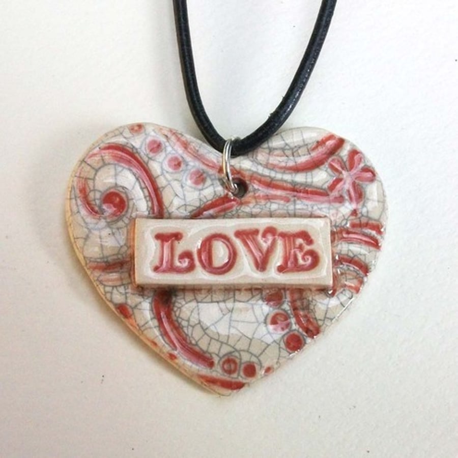 Crackle glazed red "love" heart pendant