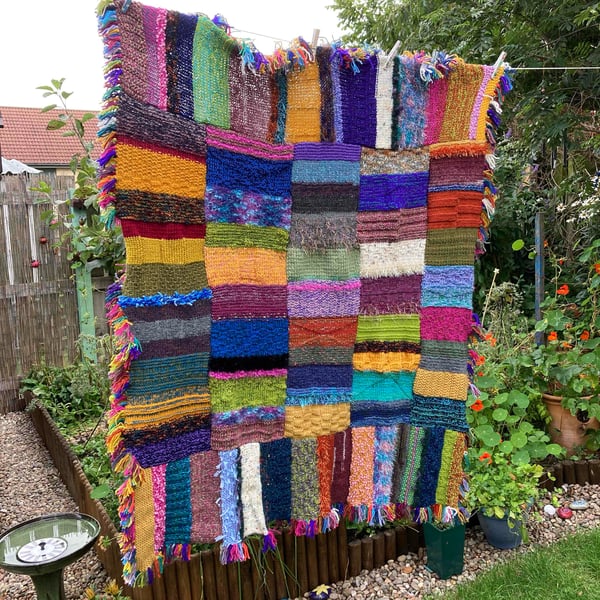 Multicoloured chunky hand knitted blanket