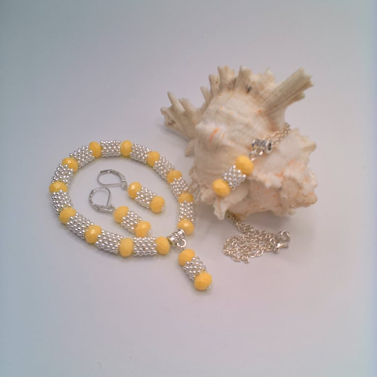 Yellow Faceted Beads and Silver Snowflake Spacers Necklace Bracelet and Earrings
