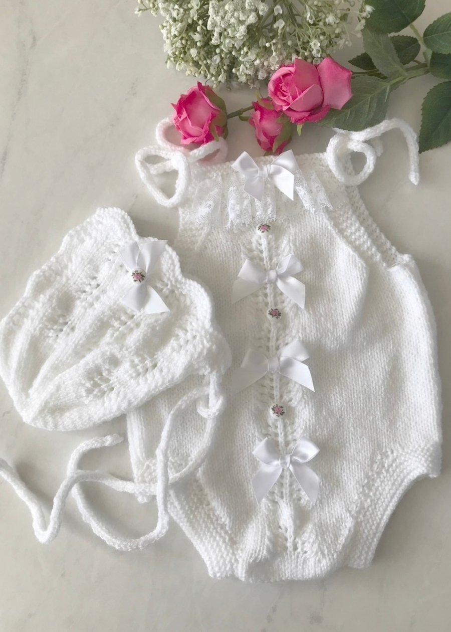 Hand knitted baby romper and bonnet