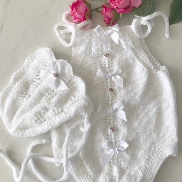 Hand knitted baby romper and bonnet