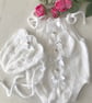 Hand knitted baby romper and bonnet