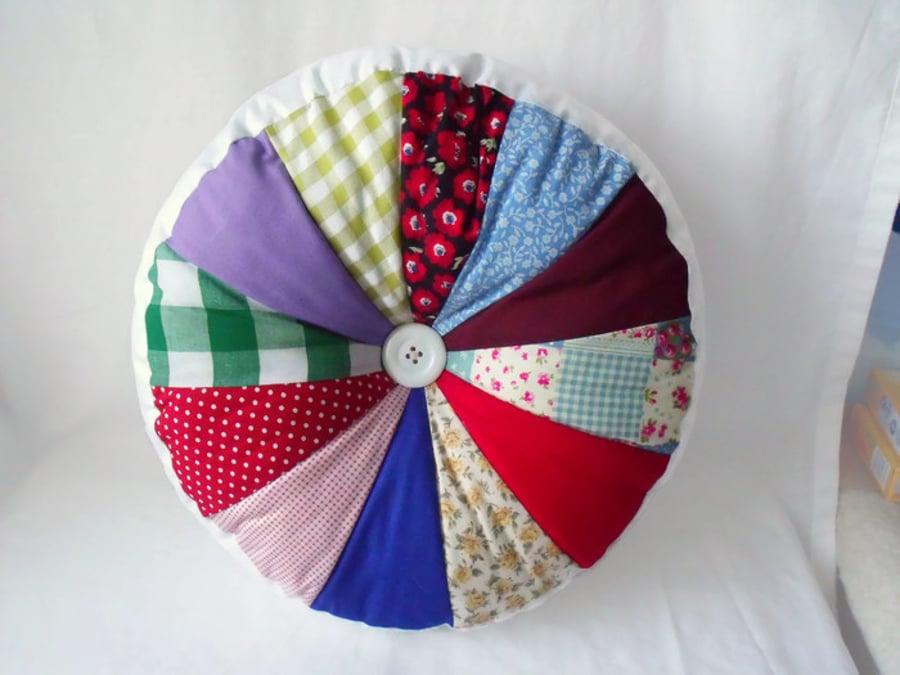 big circular chunky accent cushion, multi coloured pin wheel pillow, 13 inches