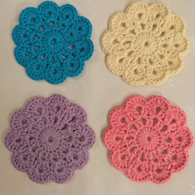 Set of 4 crochet coasters in pink, lilac, turquoise and pale yellow