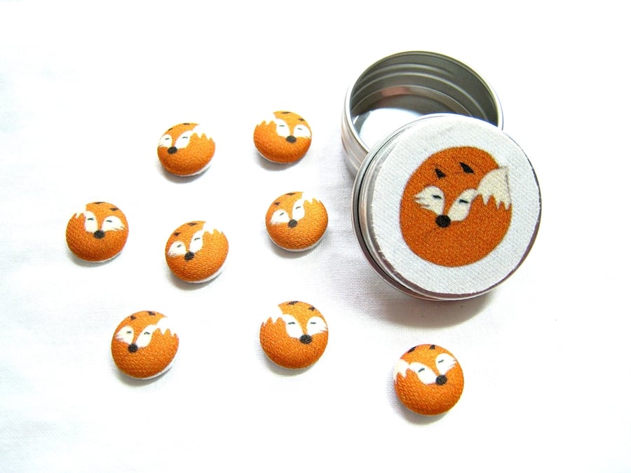 Fox sleeping and curled fridge magnets 8 in a tiny tin. Lovely gift.