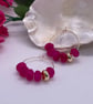 Gold plated hoops with fuchsia jade beads - Image 1