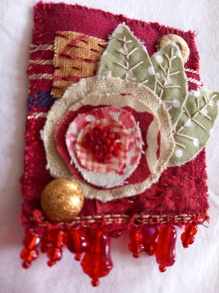 The red flower brooch